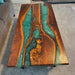 Handcrafted walnut wood table with natural grain and flowing epoxy river.