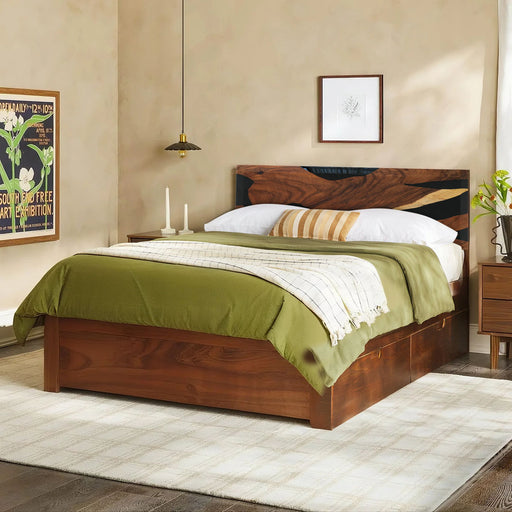 Wooden bed with green bedding in a bedroom setting