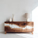 Wooden sideboard with marble inlay in a minimalistic room