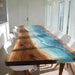 Dining table with wooden and glass design in a bright room