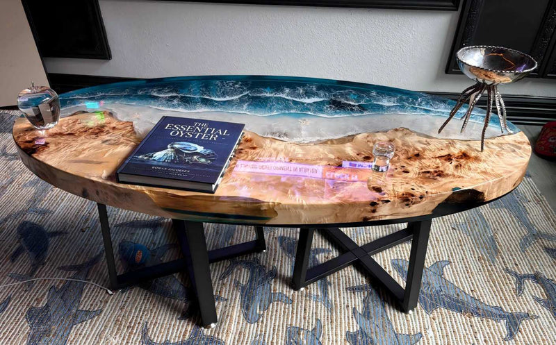 Wooden coffee table with a book and decorative items on a patterned rug.
