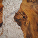 Glass-like epoxy table with wood accents for contemporary interiors.