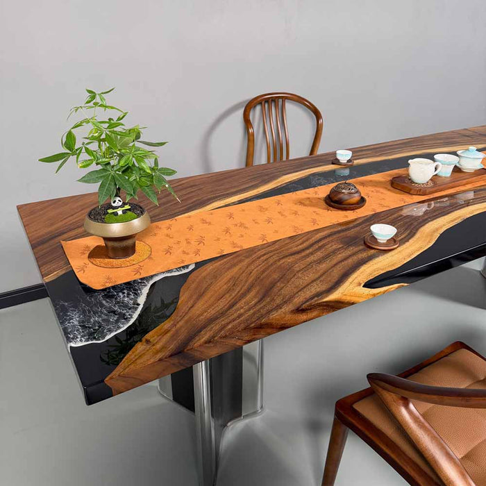 Wooden dining table with a unique design, chairs, and decorative items on a gray floor.