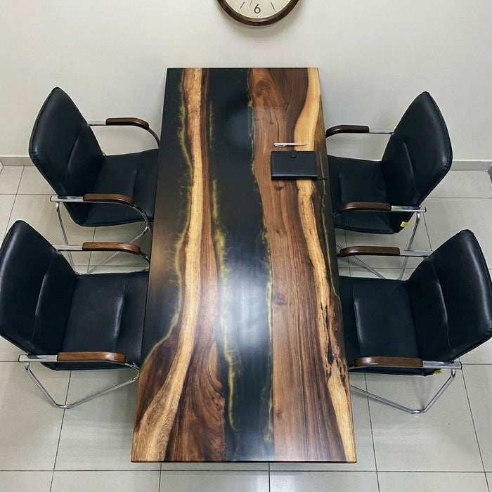 Durable industrial steel legs on a handcrafted walnut and resin river desk.