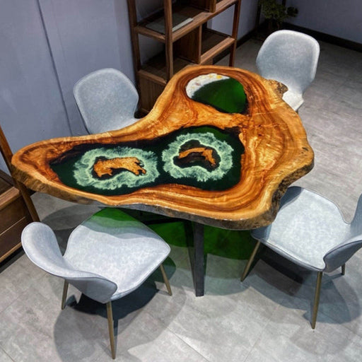 Unique irregular-shaped wooden table featuring artistic green epoxy resin inlays that resemble natural lakes, creating a stunning organic design for modern dining or office spaces.