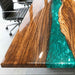 Made-to-order live edge walnut resin dining table customizable in dimensions, resin colors, finishes, and table base options.