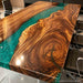 Solid walnut resin table highlighting the natural texture, dramatic grain variations, and artistic character of premium hardwood.