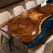 Handcrafted blue river table combining premium walnut wood and epoxy resin artistry for a distinctive furniture design.
