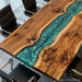 Modern custom resin dining table designed for luxury homes, combining natural hardwood and contemporary epoxy art.