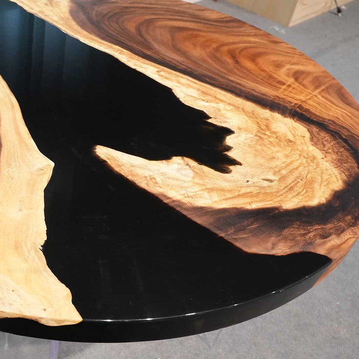 Custom round epoxy resin table with walnut wood and black resin details