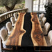 Live edge black walnut epoxy dining table with black resin river design
