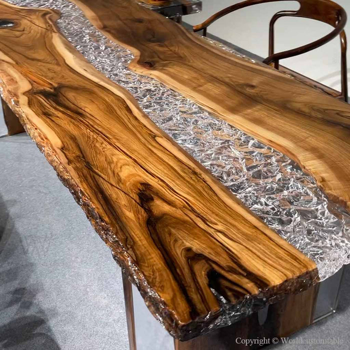 Luxury walnut slab table with crystal-clear resin inlay creating a unique flowing river effect.