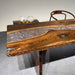 Artisan crafted walnut slab resin table featuring unique knots, natural edges, and one-of-a-kind character.