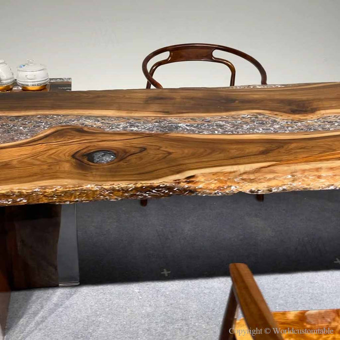 Handcrafted live edge walnut epoxy dining table showcasing organic wood patterns and modern resin craftsmanship.