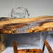 High-gloss epoxy resin surface with an ice-inspired crack effect creating a unique modern artwork.