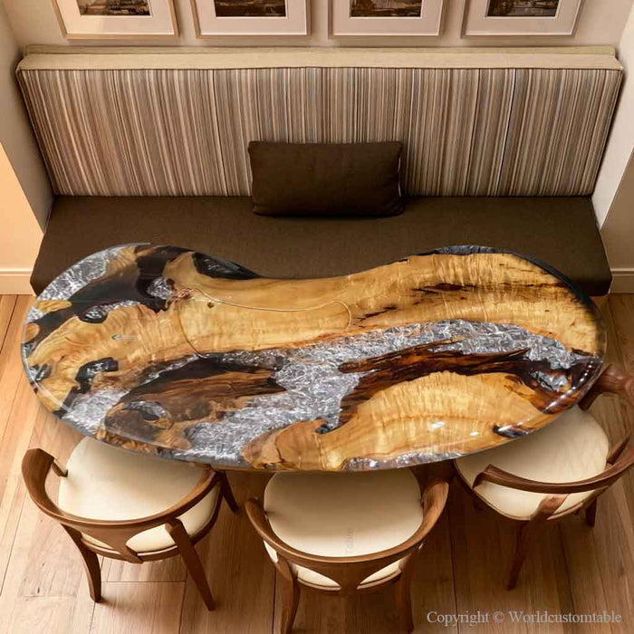 Custom golden camphor wood dining table featuring a unique ice crack epoxy river design and glossy resin finish.