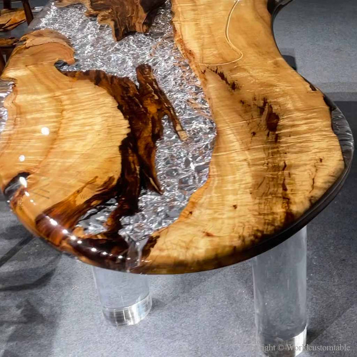 Live edge golden camphor epoxy dining table showcasing natural wood grain, knots, and organic details.