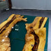 Custom green epoxy resin table combining natural wood beauty with modern artistic resin design.