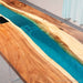 Blue green resin river meeting table made from walnut wood