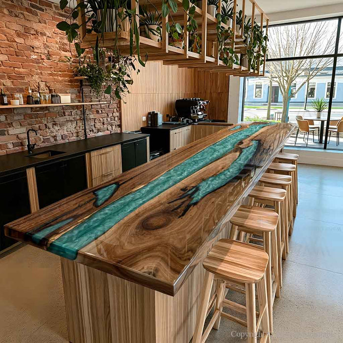 Black walnut epoxy bar top with a striking teal vortex resin design