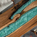 Custom teal resin bar top crafted from natural black walnut wood