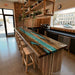 Custom black walnut bar top with swirling teal epoxy resin