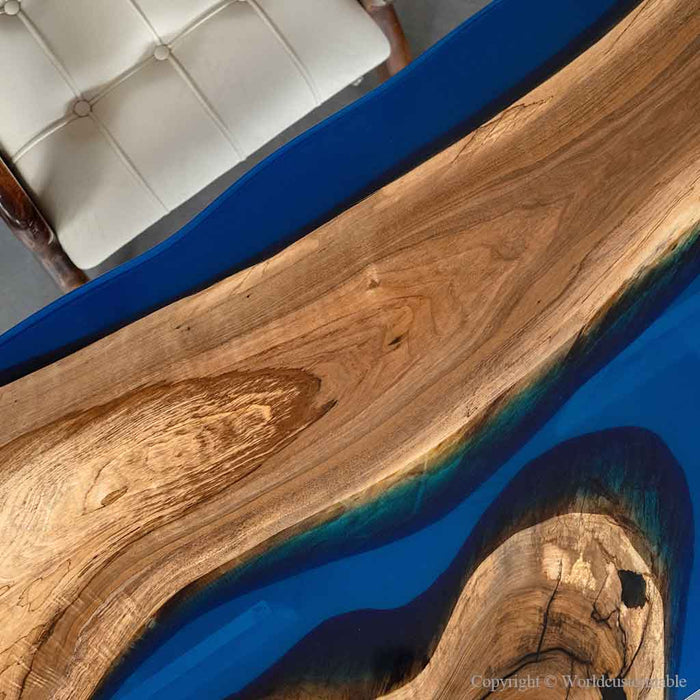 Ocean inspired epoxy coffee table with natural walnut grain and blue resin