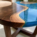Modern walnut coffee table featuring artistic blue epoxy resin