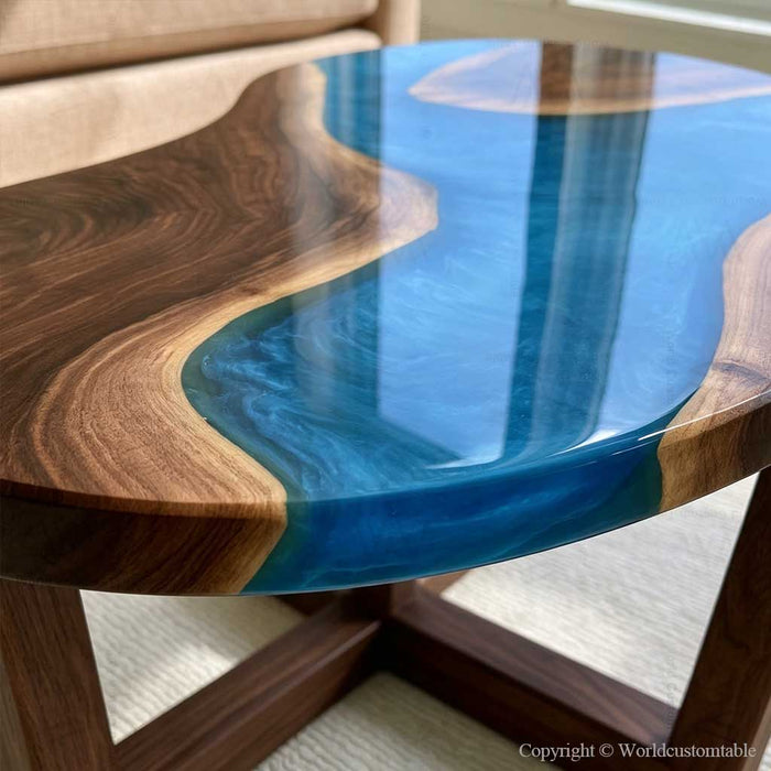 Organic shaped blue epoxy coffee table crafted with natural walnut