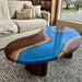 Walnut epoxy coffee table with blue resin and a unique Ocean Drop design