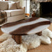 Black walnut epoxy coffee table with a distinctive pea shaped silhouette and white resin