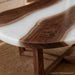 Organic shaped epoxy coffee table crafted from natural walnut with white epoxy