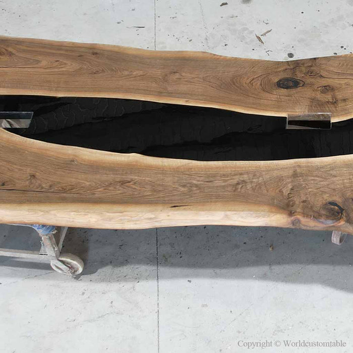 Large black epoxy boardroom table crafted from natural black walnut
