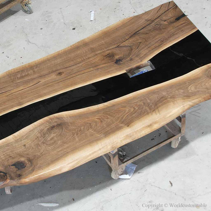 Live edge walnut office conference table with black resin river design