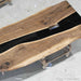 Live edge walnut office conference table with black resin river design