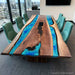 Small conference table crafted from black walnut with peacock blue epoxy resin