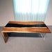 Black walnut desk featuring a single side waterfall leg