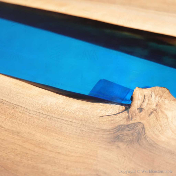 Modern walnut desk featuring a flowing blue resin river