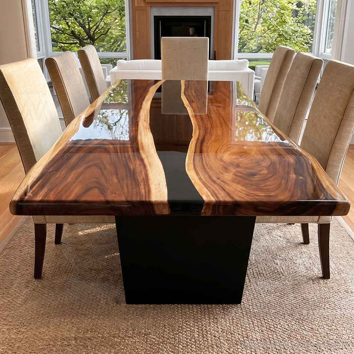 Walnut dining table with deep black epoxy resin