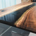 Executive conference table with black epoxy and gold accents