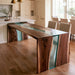 Ocean Veil black walnut epoxy waterfall table with transparent teal resin and natural wood grain