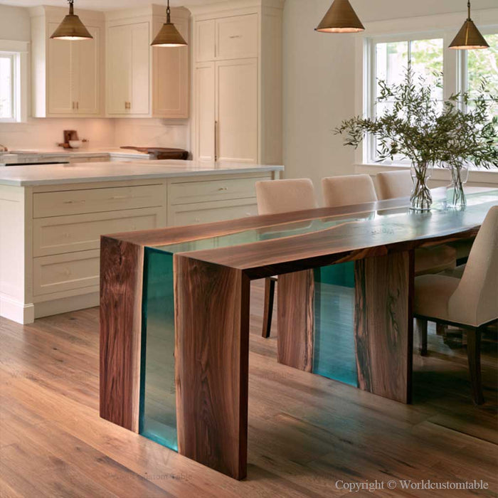 Handcrafted black walnut epoxy table showcasing polished transparent teal resin and distinctive wood patterns