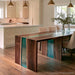Handcrafted black walnut epoxy table showcasing polished transparent teal resin and distinctive wood patterns