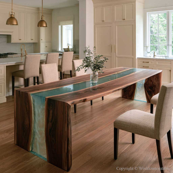 Luxury coastal home featuring a black walnut epoxy waterfall dining table with ocean inspired teal resin