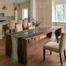 Luxury coastal home featuring a black walnut epoxy waterfall dining table with ocean inspired teal resin