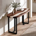 Black walnut epoxy console table with white resin positioned behind a sofa in a contemporary living room