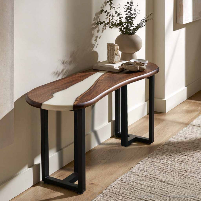Luxury hallway featuring a black walnut epoxy console table with white resin styled with elegant home accessories