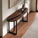 Black walnut epoxy console table placed behind a sofa in a contemporary living room