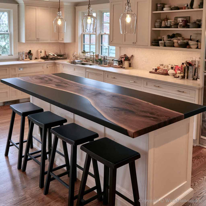 Modern black walnut island top with black epoxy resin and a waterfall edge design
