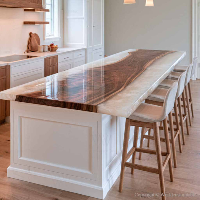Black walnut epoxy island top with a pearl white resin river in a modern kitchen